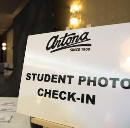 Artona takes formal portraits of each student in their suit or dress, and gifts each student a package of their photos